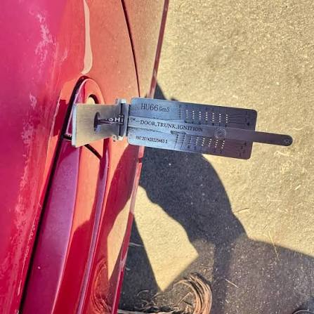 I Got Whipz Auto Locksmiths near me picking a lock on a car at 8300 Windsor Mill Rd, Windsor Mill, MD 21244